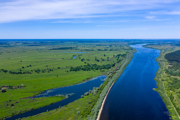 Big river and flood meadows. Aerial drone view