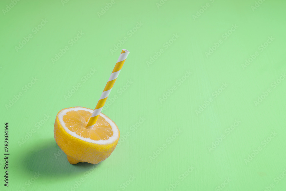 Poster Lemon with paper straw on neo mint background