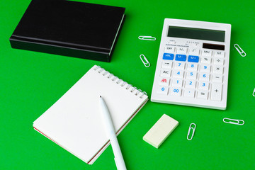 Green office desk with white stationery, copy space