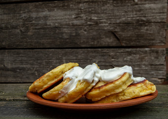homemade corn pancakes with sour cream, nuts and figs