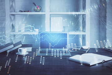 Stock market graph on background with desk and personal computer. Multi exposure. Concept of financial analysis.