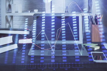 Financial graph colorful drawing and table with computer on background. Double exposure. Concept of...
