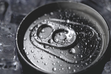 Aluminum soda can lid cover of soft drink and ice close-up