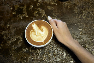 Close-Up Of Woman Holding Coffee