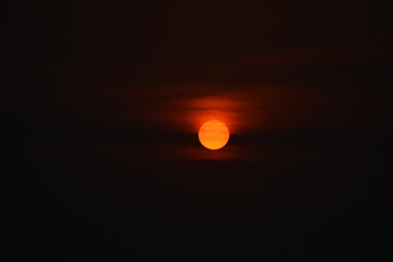 orange sun in a dark ( beautiful sunset )