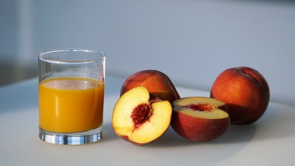 peaches and glass of juice