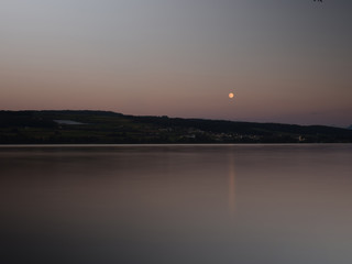 view of the lake after sunset, moonrise, beautiful colors