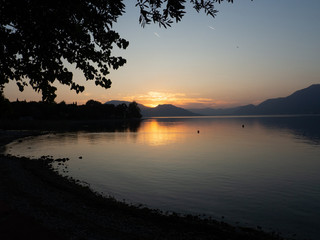 Fototapeta na wymiar Sunset at Lago d'Iseo or Lake Iseo, Italian Lakes area, showing peaceful setting and location