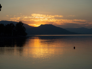 Sunset at Lago d'Iseo or Lake Iseo, Italian Lakes area, showing peaceful setting and location