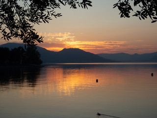 Sunset at Lago d'Iseo or Lake Iseo, Italian Lakes area, showing peaceful setting and location