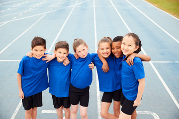Portrait Of Children In Athletics Team On Track On Sports Day - obrazy, fototapety, plakaty