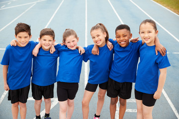 Portrait Of Children In Athletics Team On Track On Sports Day