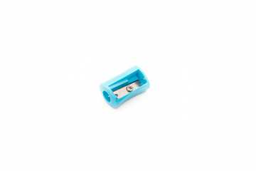 Blue plastic sharpener for a pencil on a white background.