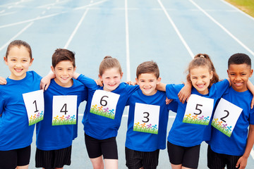 Portrait Of Children On Athletics Track Wearing Competitor Numbers On Sports Day - obrazy, fototapety, plakaty