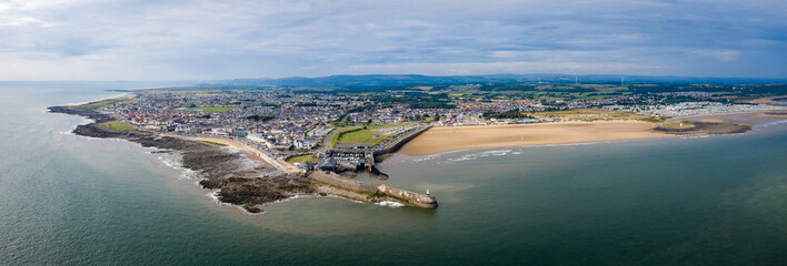 Aerial view of Porthcawl beach harbour and fun fair in South Wales UK