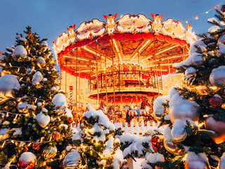 Beautiful brightly glowing carousel on the Red Square decorated and arranged for Christmas and New...