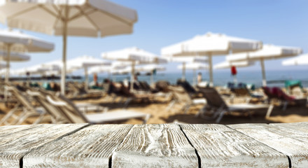 Desk of free space and beach background 