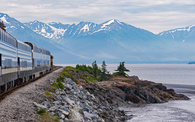 Turnagain Arm of Cook Inlet in Alaska from the Train showing the shoreline with mountains and...