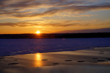 sunset over the frozen lake in japan