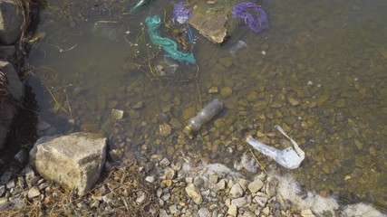 Old trash on the surface of the river 
