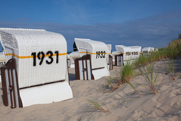 Fototapeta na wymiar Typical beach chairs on the beach, Baltic coast, Germany.
