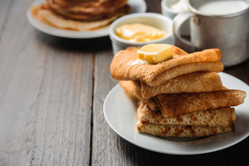 Russian pancakes blini with piece of butter