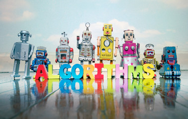 ALGORITHMS wooden letters and retro robot toys