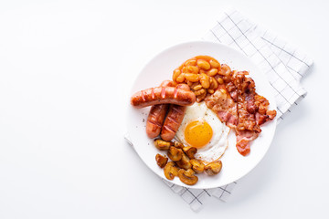 Classical english breakfast with fried bacon, mushrooms and eggs. Flatlay on white background