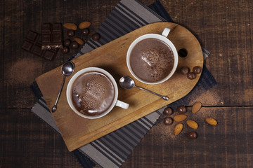 Obraz na płótnie Canvas Almonds and hot chocolate top view