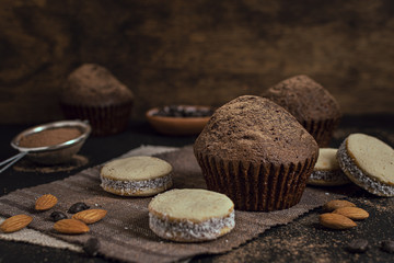 Muffins and cookies with blurred background