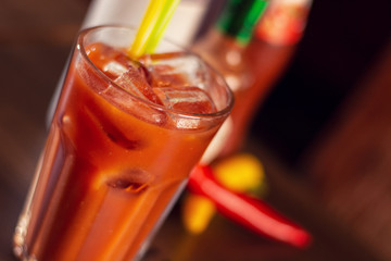 bloody marry drink on wooden table close up