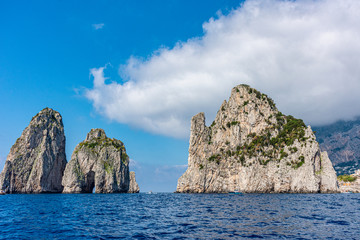 Fototapeta na wymiar Italy, Capri, view of the faraglioni seen from the sea.