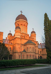 Obraz premium Chernivtsi, Ukraine - May 9, 2018: The Residency of the Chernivtsi National University. Exterior facade of Chernivtsi University from the street in the morning. University courtyard.