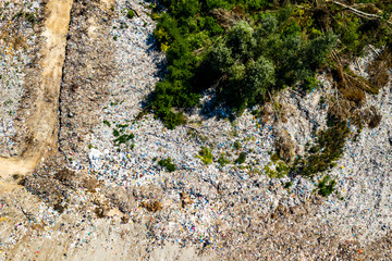 Aerial view of dump in forest. Pollution concept, top view.