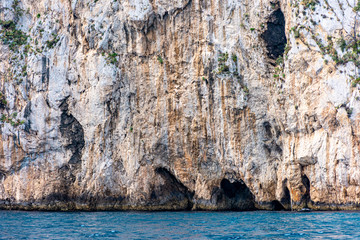 Italy, Capri, view of the coast seen from the sea.