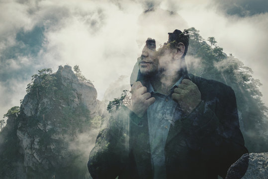 Double exposure. Man and wild mountains