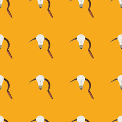 Seamless pattern with sickle and vintage light bulb on orange color