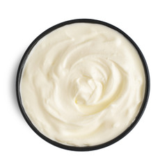 Sour cream in bowl, mayonnaise, yogurt, isolated on white background. Top view.