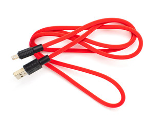 Red USB cable for smartphone isolated on white background. Top view