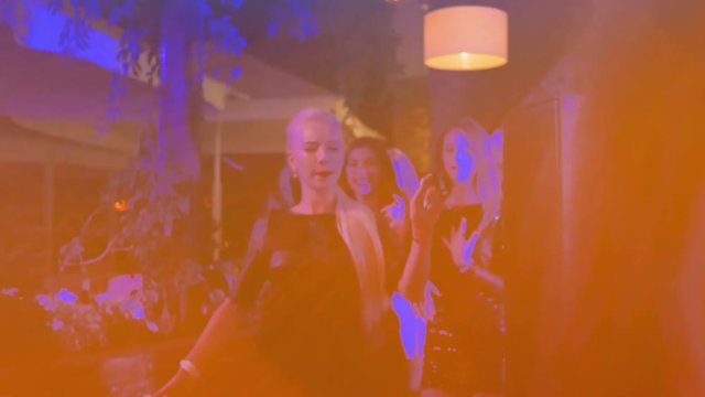bachelorette party, young beautiful girls with slim bodies go actively moving to dance floor of a nightclub