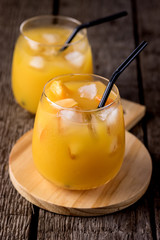 Glass of Ripe Peaches or Apricot of Juice on Wooden Background Tasty Cold Apricot Juice Vertical