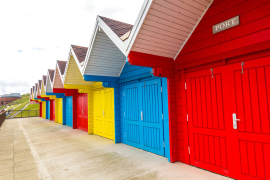 Bright, colorful beach huts in Whitby, England