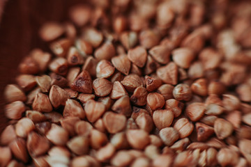 Macro close-up photo of buckwheat groats. Texture background grain buckwheat groats. Image food product porridge buckwheat