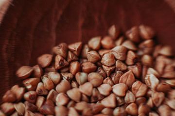 Macro close-up photo of buckwheat groats. Texture background grain buckwheat groats. Image food product porridge buckwheat