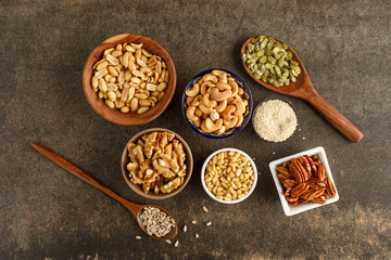 Close-up view of different types of nuts in bowls
