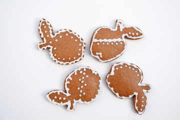 Gingerbread apples decorated by white icing