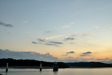 Naklejka na ściany i meble A photo of the lake and sunset