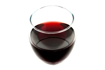 Fotobehang Glass of red wine isolated on white background © ayuk1