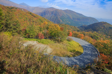 Road along the mountain with leaves turning color - Nikko, Japan