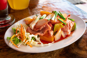 Fried pork served with spicy sweet vegetables.